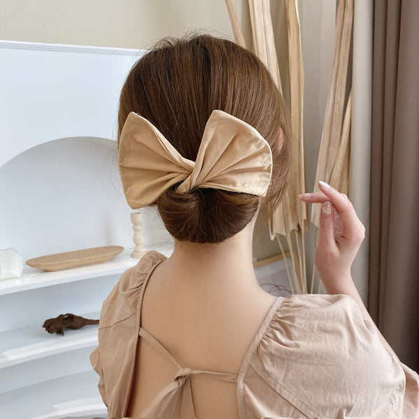 Diadema con lazo estampado de artefacto de pelo largo rizado y retorcido mágico para mujer de moda