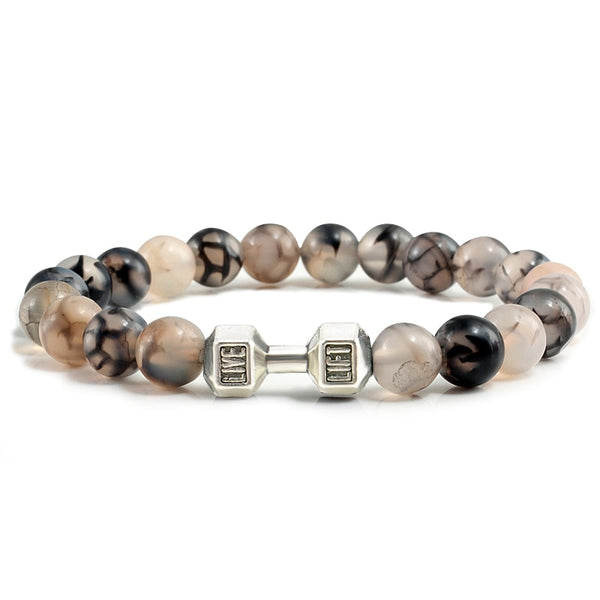 Pulsera de piedra volcánica natural para hombre, con cuentas blancas y negras mate, con dijes de mancuernas.
