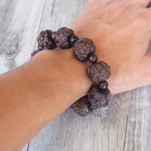 Pulsera de loto tallada en madera negra de Buda tibetano