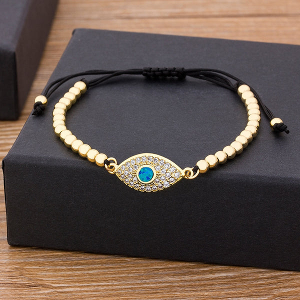 Pulsera ajustable con cuentas de cobre y circonita cúbica de ojo malvado