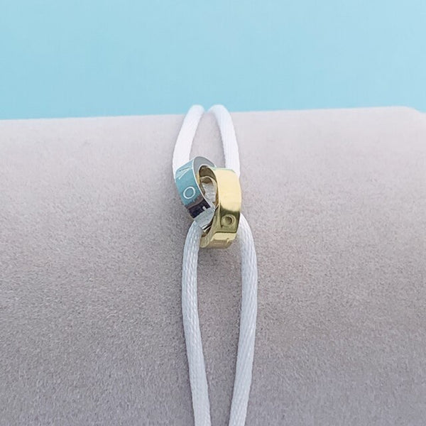 Pulsera de cuerda ajustable con dos círculos cruzados